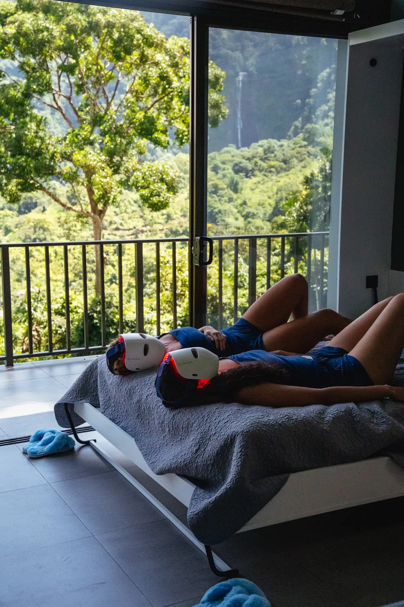 Guests relaxing together inside one of the villas with scenic jungle views at Vajra Jahra Retreat Center.