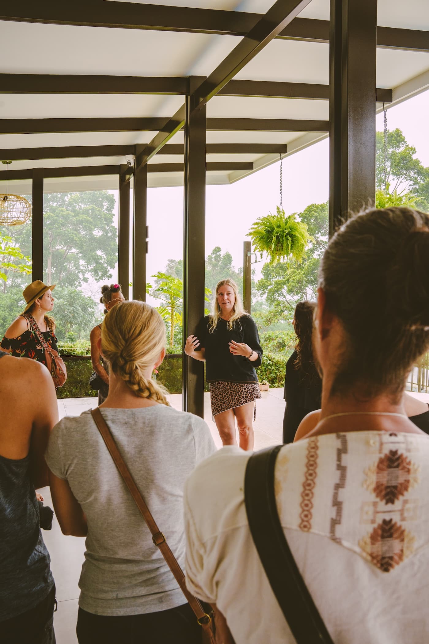 Guests in a circle having a conversation in Vajra Jahra's open air yoga space.