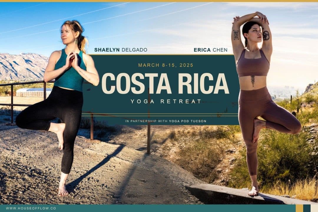 two women in tree pose in front of yoga retreat sign