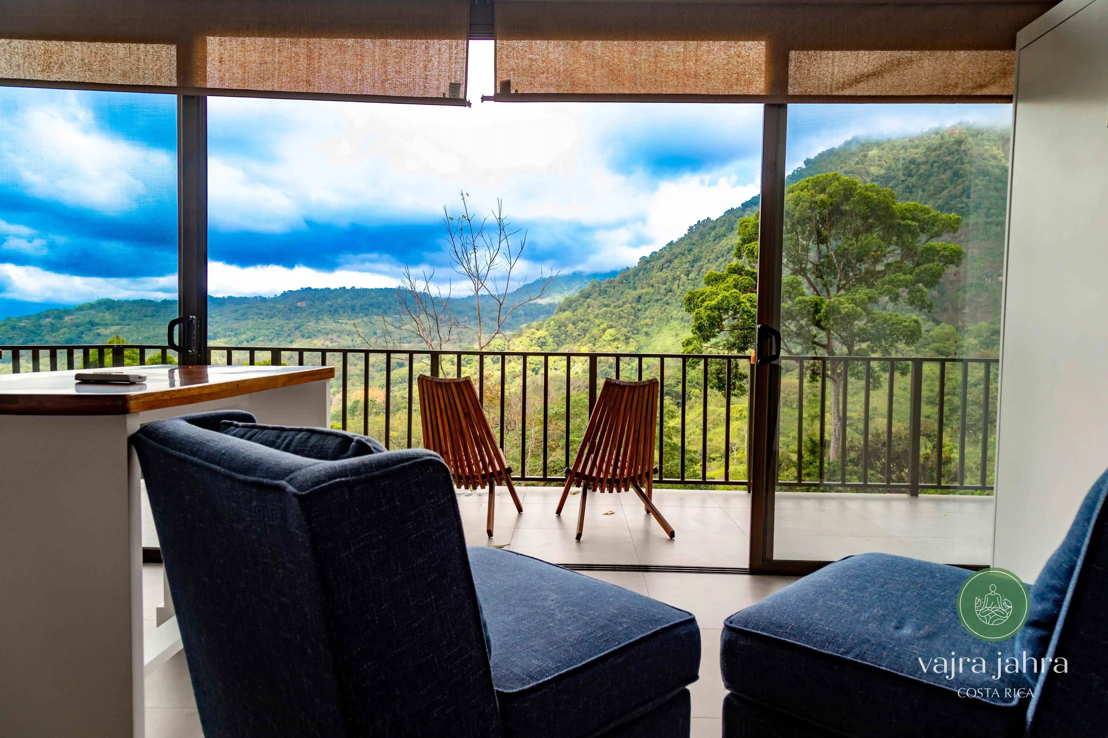 View of the jungle from one of the villas. Showing two chairs on the private deck.