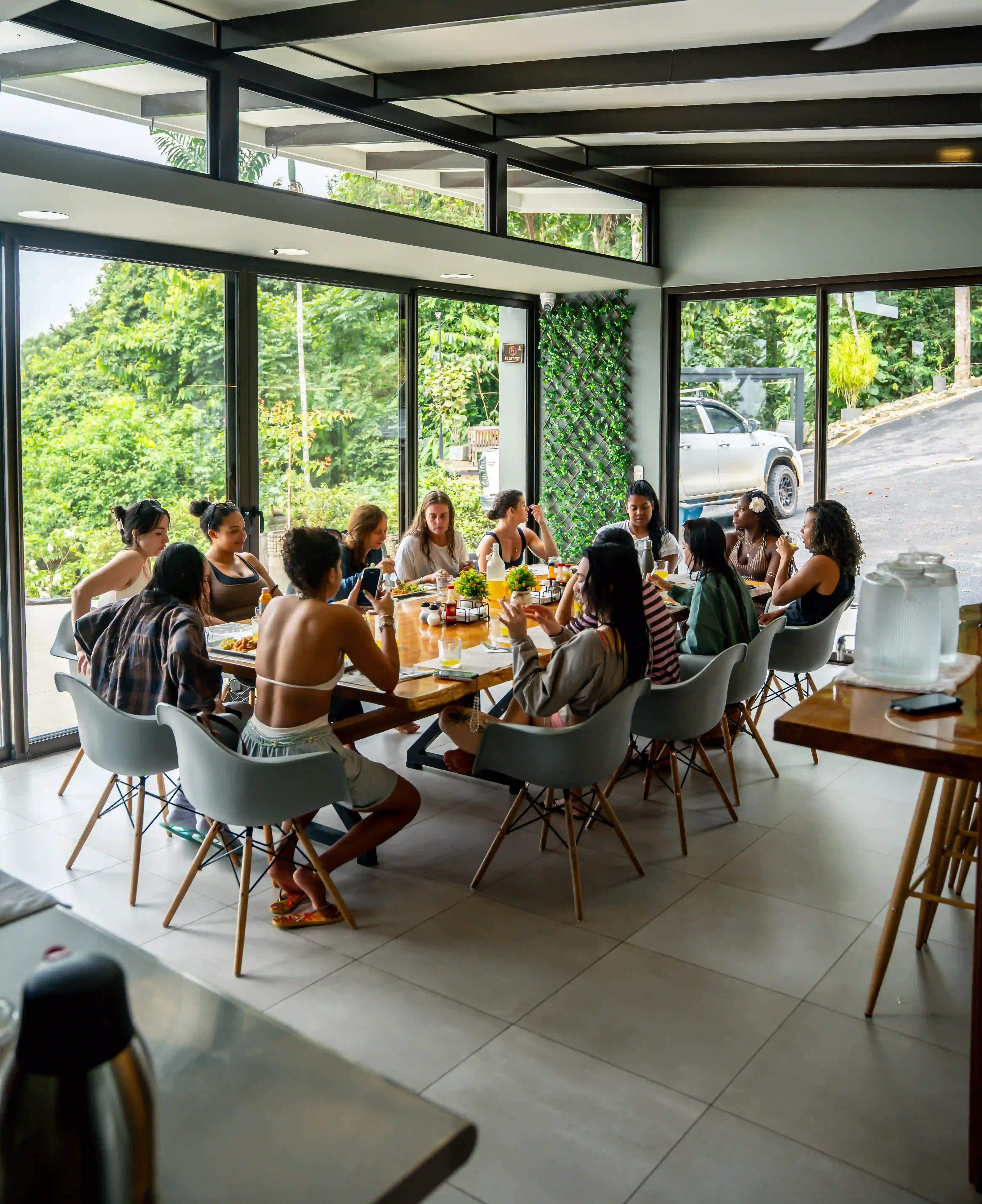 Group enjoying the dining space with mountain views at Vajra Jahra Costa Rica Retreat Center.