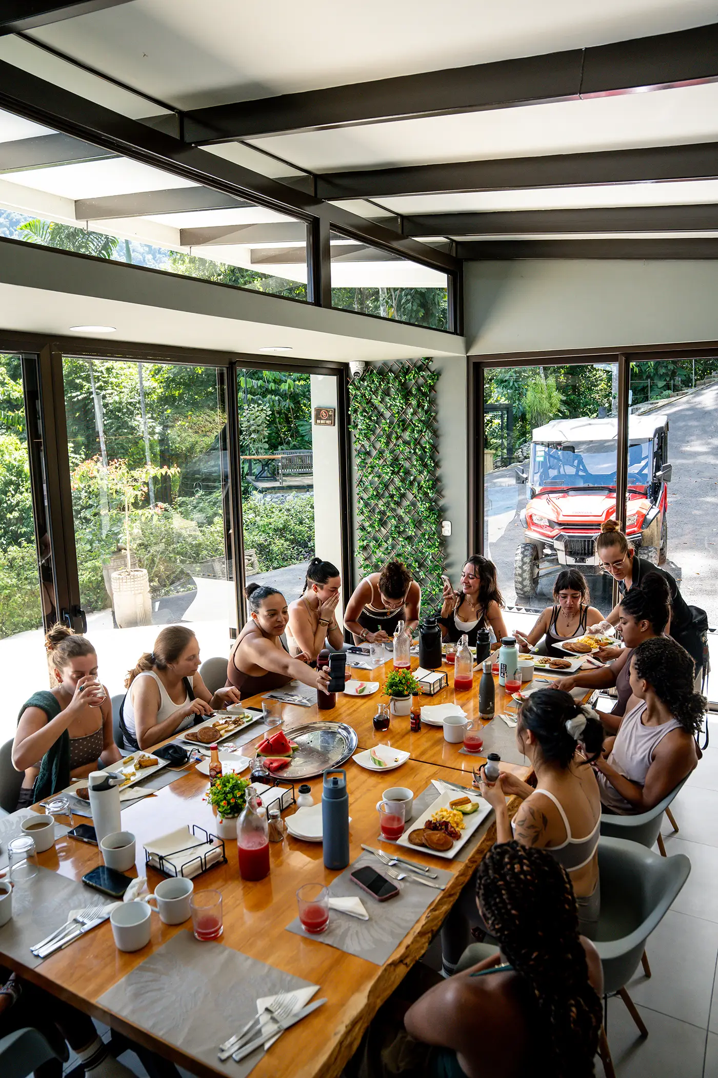 Guests sharing a meal together at Vajra Jahra, embracing community and connection at the Wellness Retreat Center.