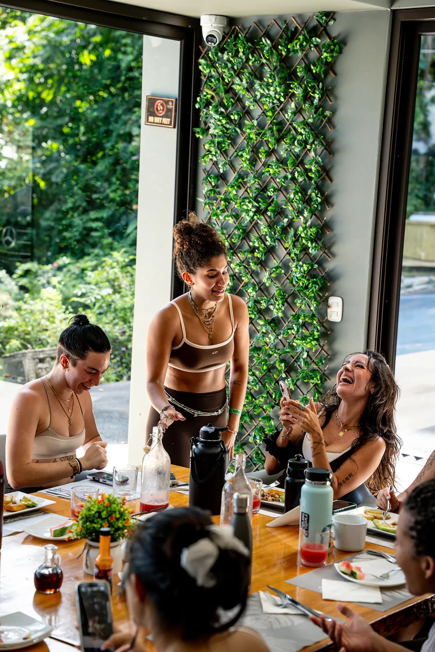Guests sharing a meal together at Vajra Jahra, embracing connection and community at the Wellness Retreat Center.