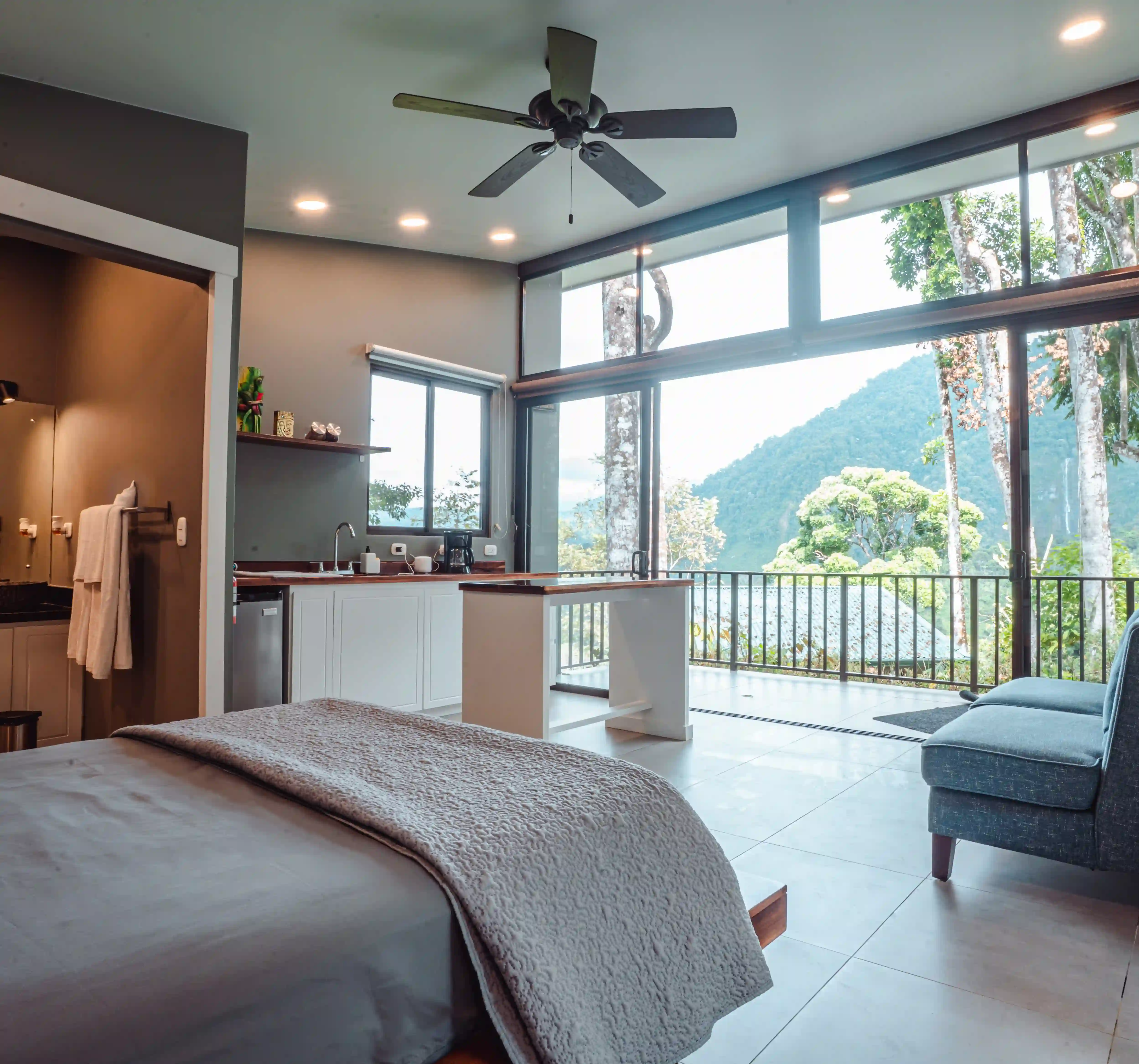 Queen bed inside a private villa at Vajra Jahra, a Costa Rica Retreat Center offering peaceful private accommodations.