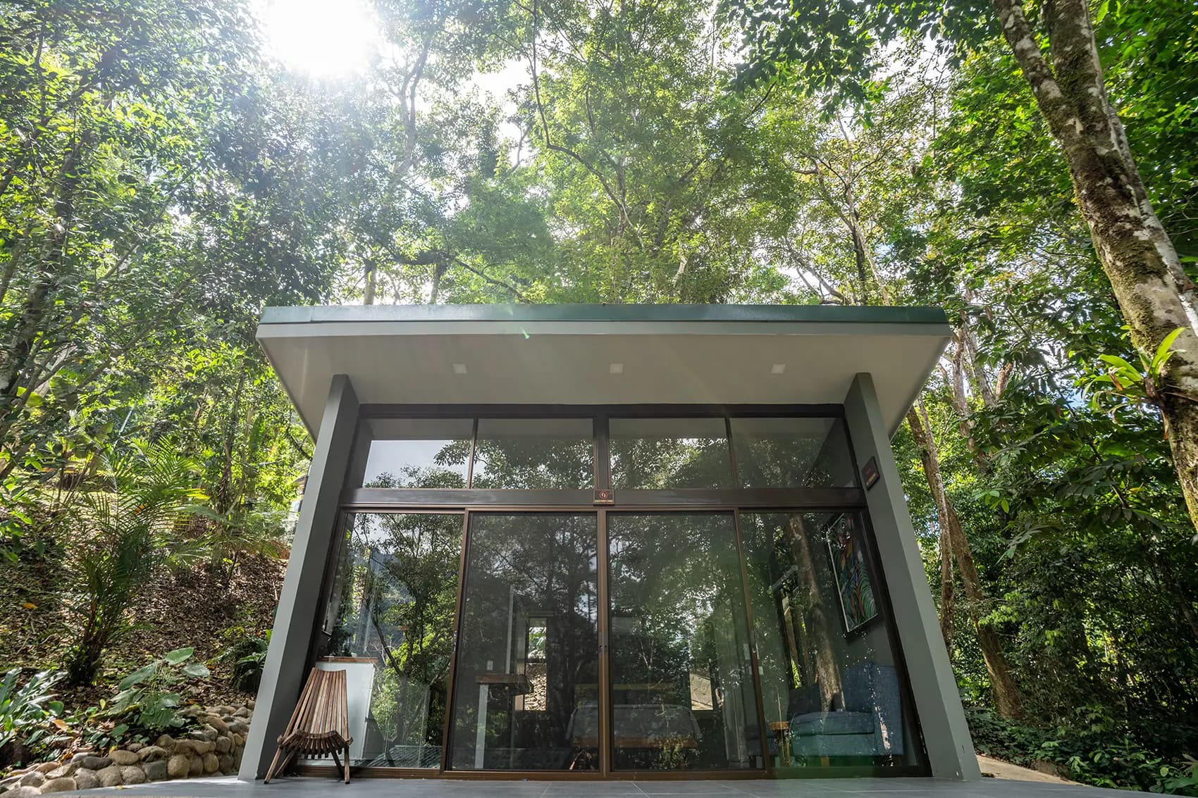 Modern villa surrounded by lush tropical greenery at Vajra Jahra Wellness Retreat Center