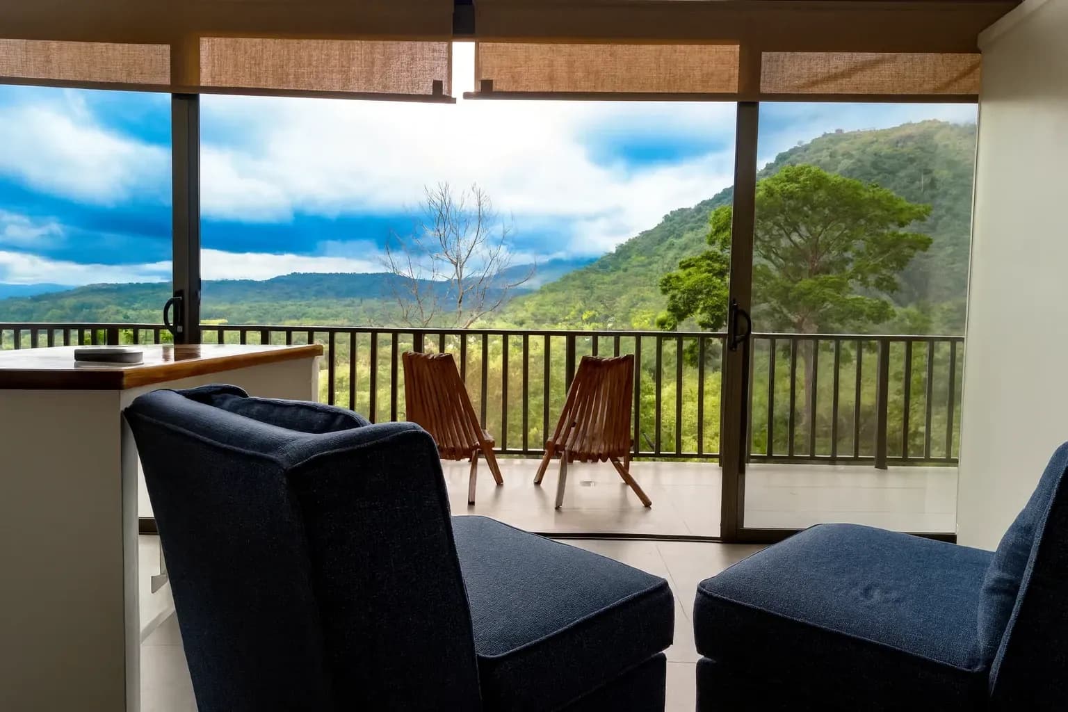 Vajra Jahra Retreat Center mountain-view villa with balcony seating overlooking the jungle, offering a serene Airbnb Dominical Costa Rica experience.