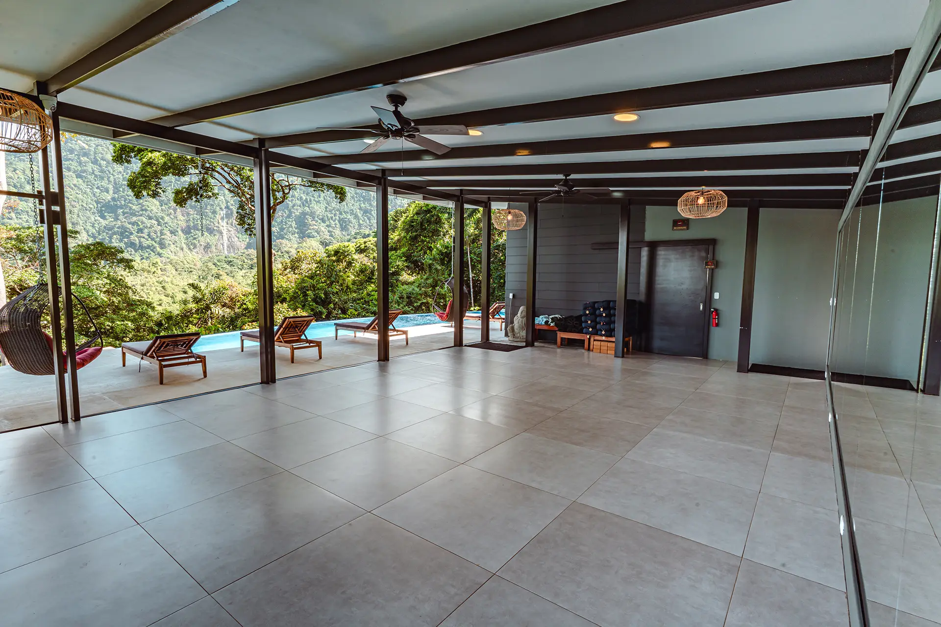 Open-air meeting space at Vajra Jahra Retreat Center, a serene Corporate Retreat Venue surrounded by Costa Rican jungle views.