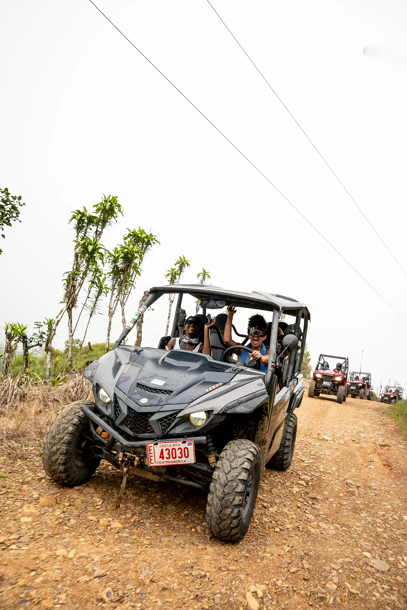 People in ATVs during an adventure outing near Vajra Jahra Retreat Center, highlighting fun excursion options for Costa Rica Yoga Teacher Training participant