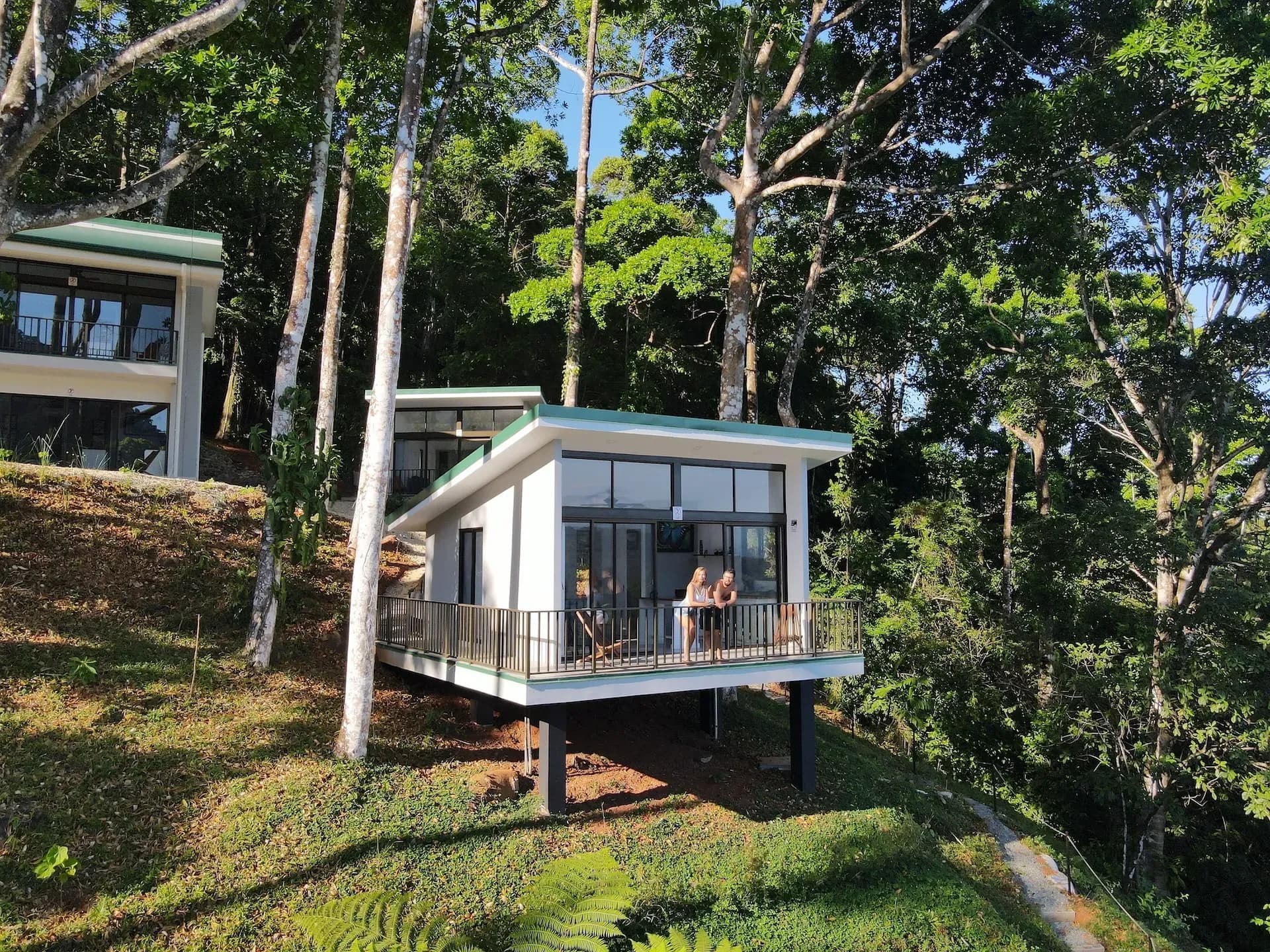 Guests relaxing on the balcony of a jungle-view villa at Vajra Jahra, a serene retreat center in Costa Rica.