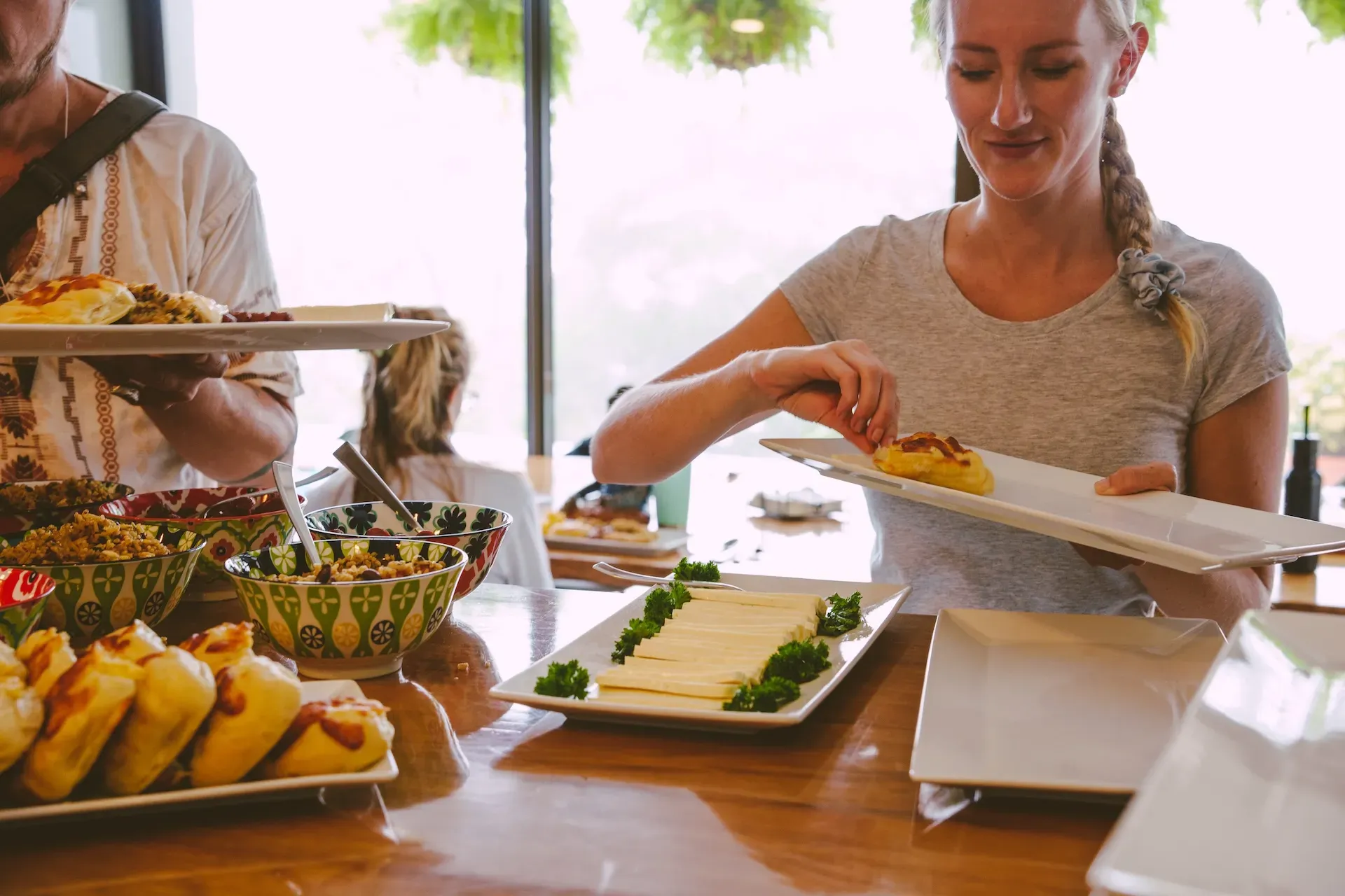A woman enjoying the local cuisine offered at Vajra Jahra. Guests get to experience a taste of Costa Rica retreat center.