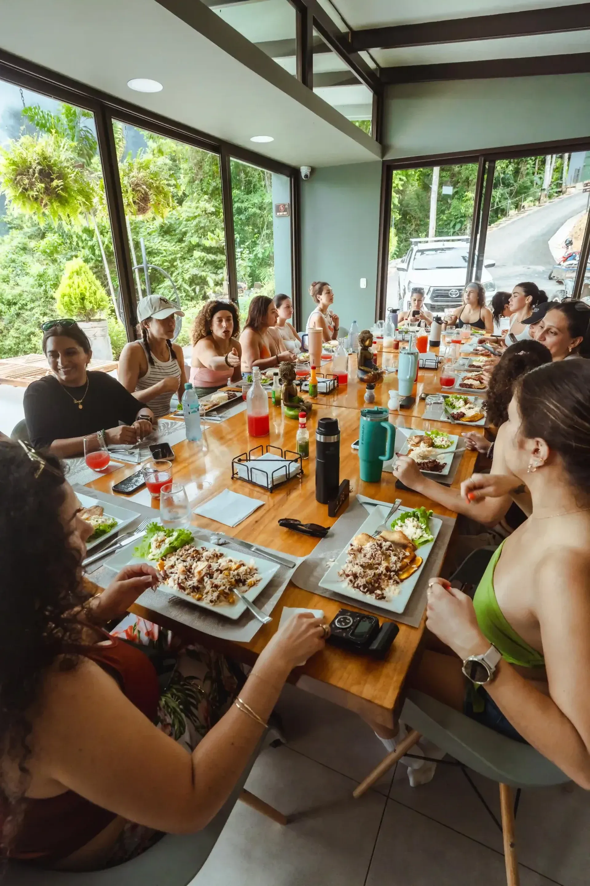 Guests gathered for a communal lunch at Vajra Jahra, a Costa Rica Retreat Center offering fresh, locally inspired meals.
