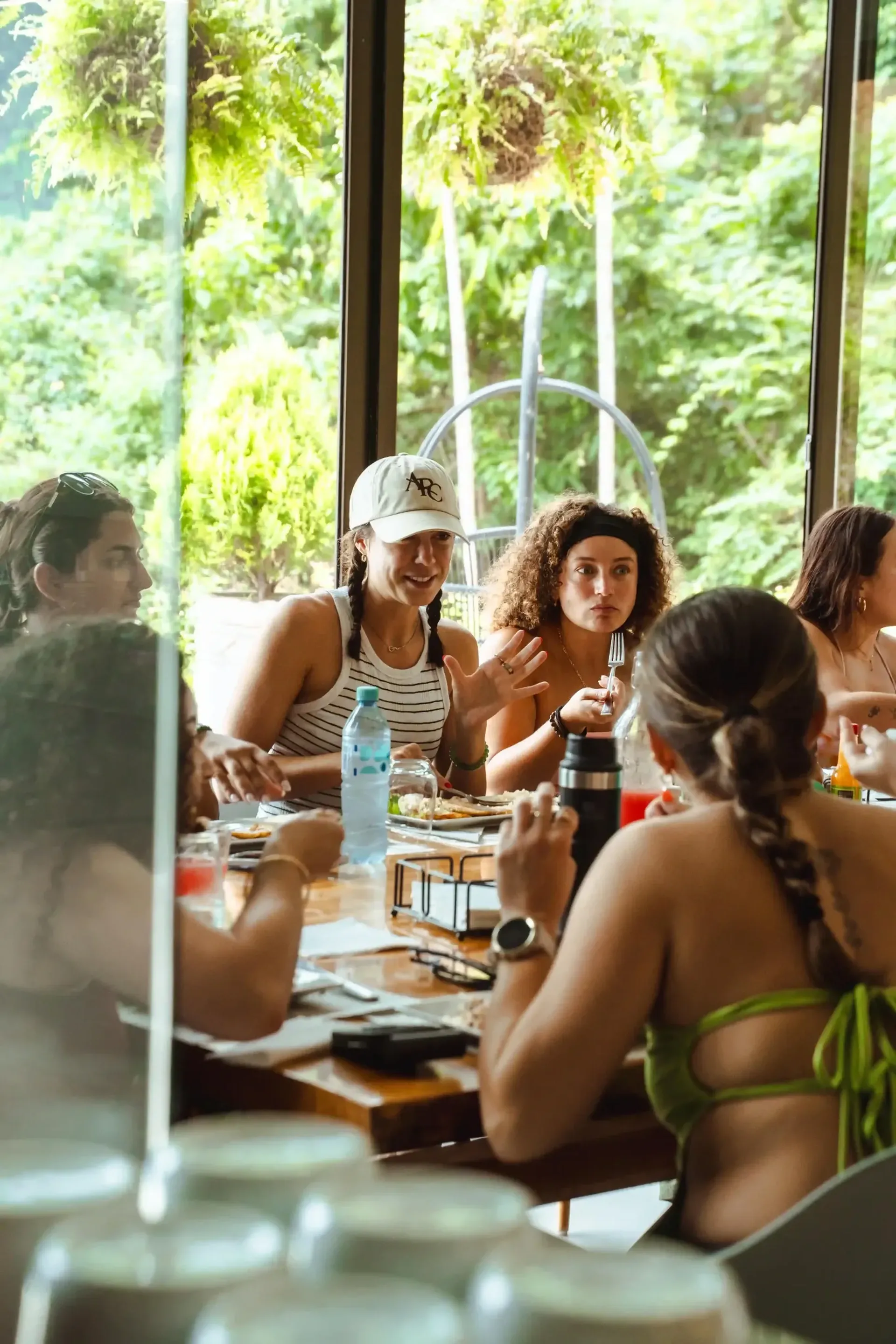Guests enjoying a fresh communal meal at Vajra Jahra, a Costa Rica Retreat Center surrounded by lush jungle views.