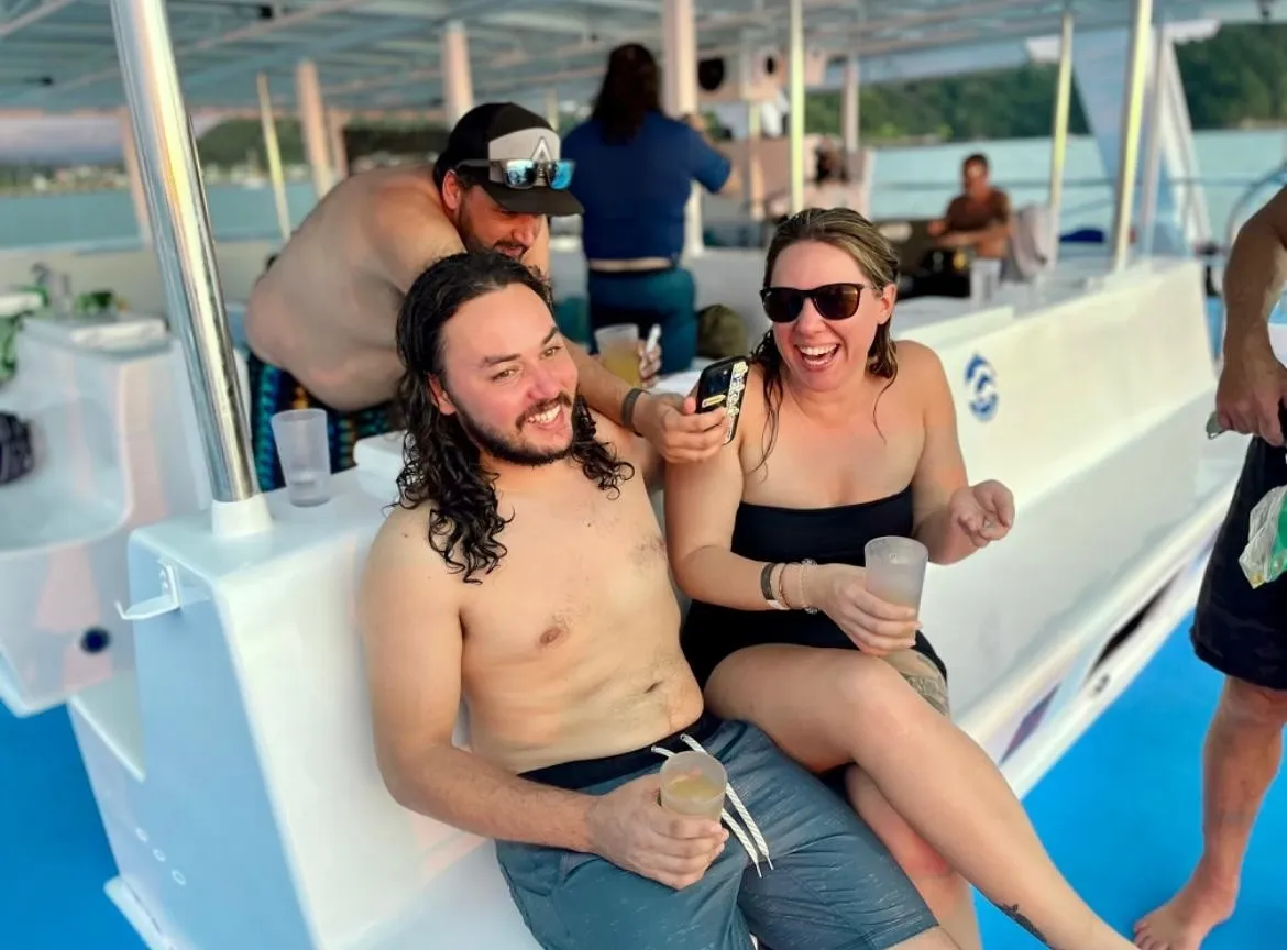 Couple enjoying catamaran tour during San Jose Costa Rica excursions.