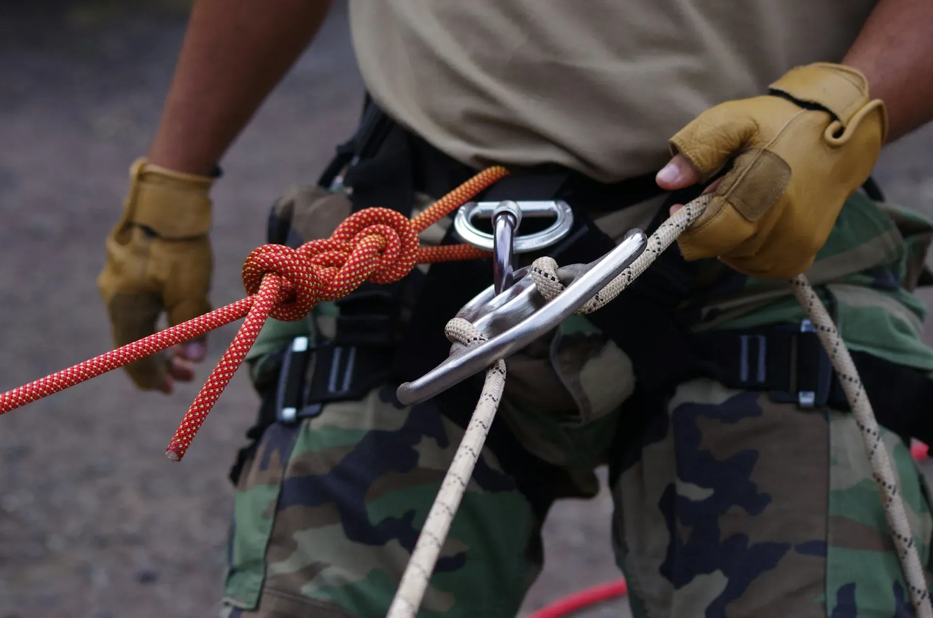 A guide preparing climbing ropes and safety gear for an adventure activity at Vajra Jahra Retreat Center, a breathtaking choice among Costa Rica wedding venues.