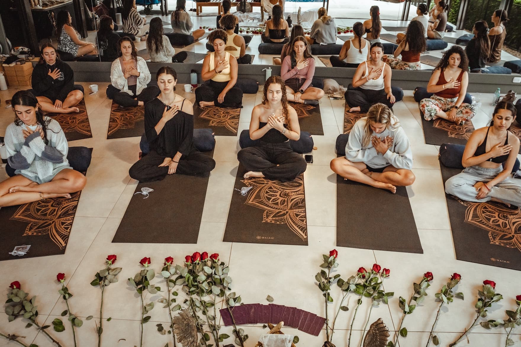 Women on yoga mats taking part in wellness practice at a Vajra Jahra retreat in Costa Rica.