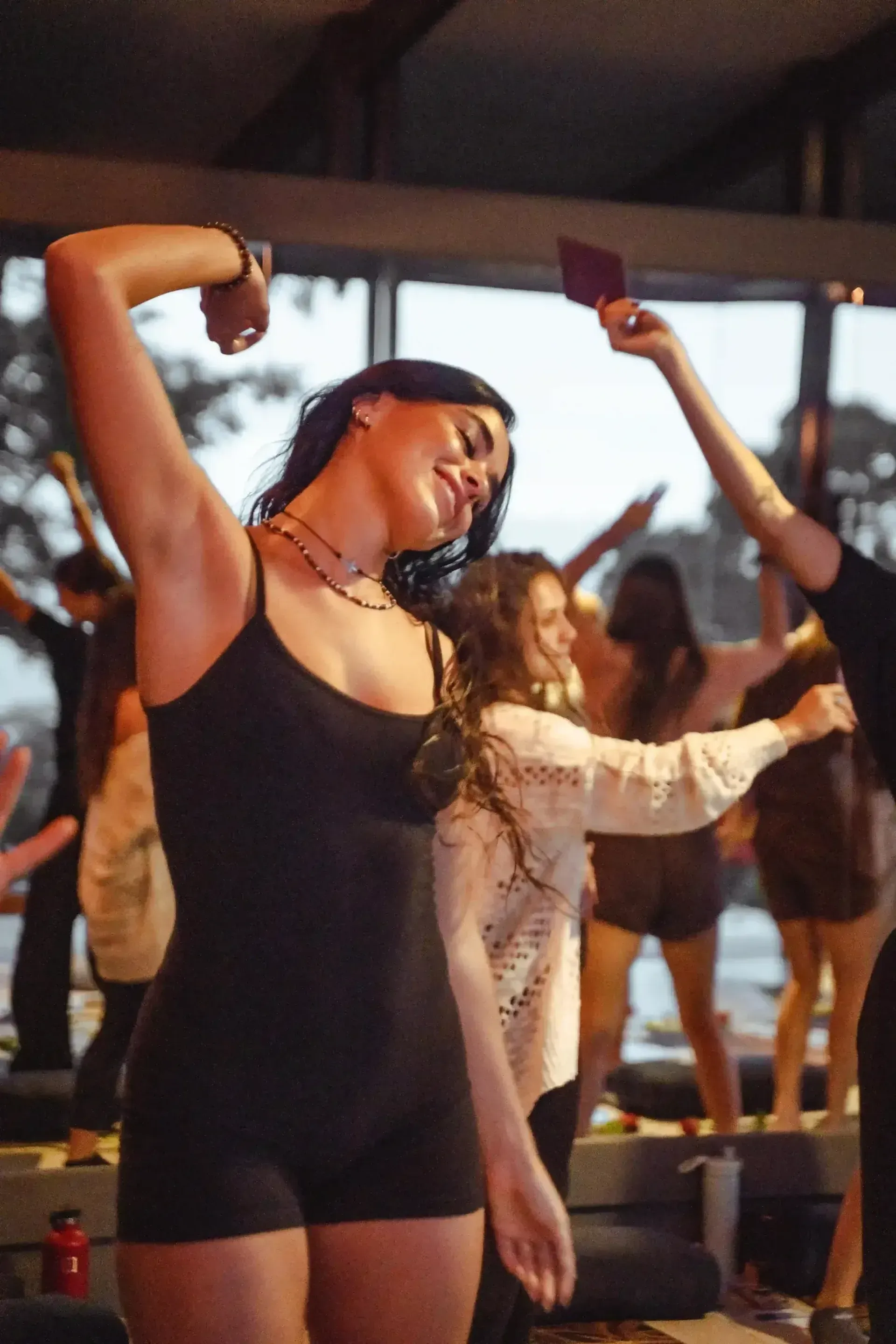 Participants dancing freely during an ecstatic movement session at Vajra Jahra Retreat Center, an energizing Corporate Retreat Venue in Costa Rica.