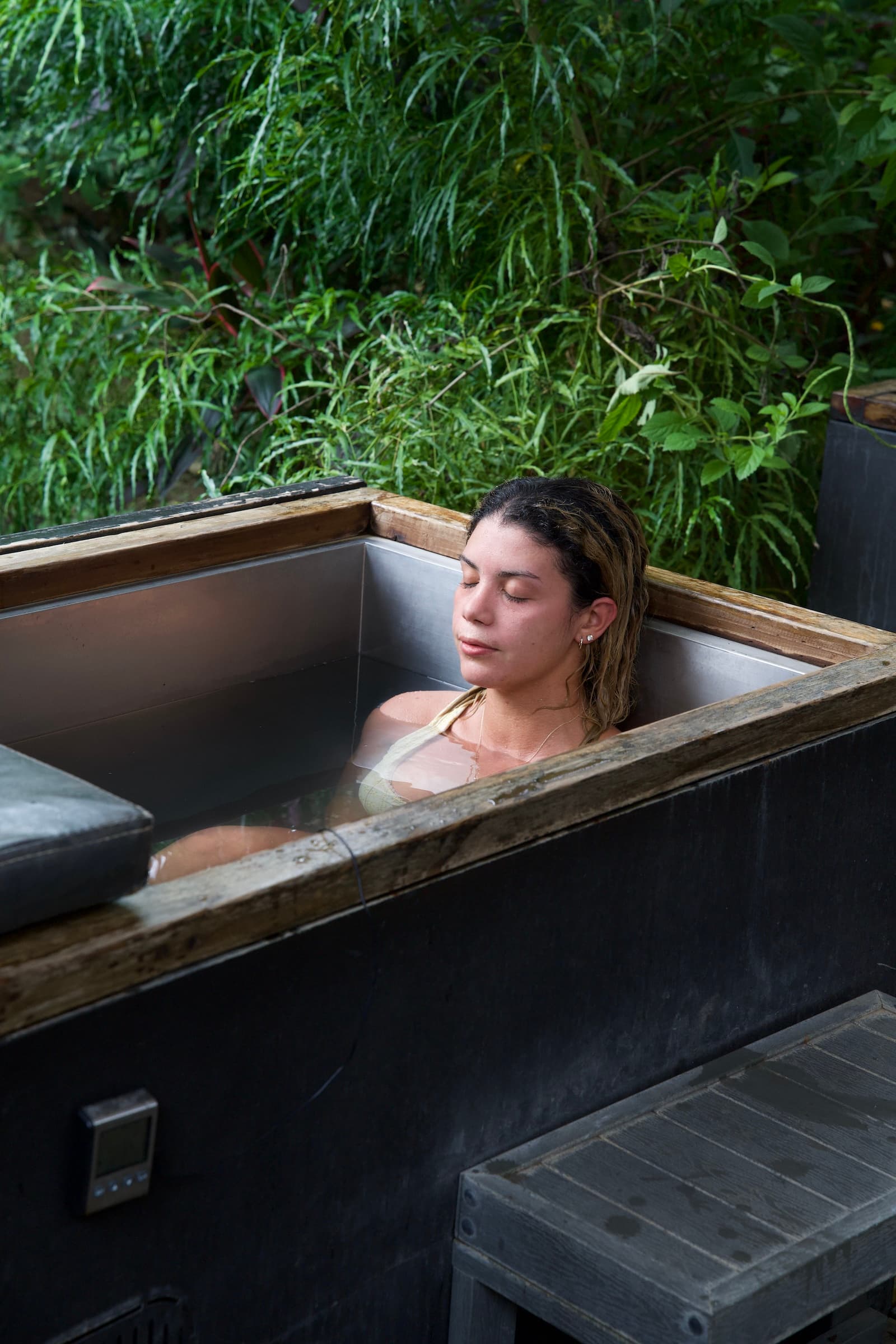 Guest relaxing in cold plunge tub in Costa Rica jungle setting on a Vajra Jahra retreat