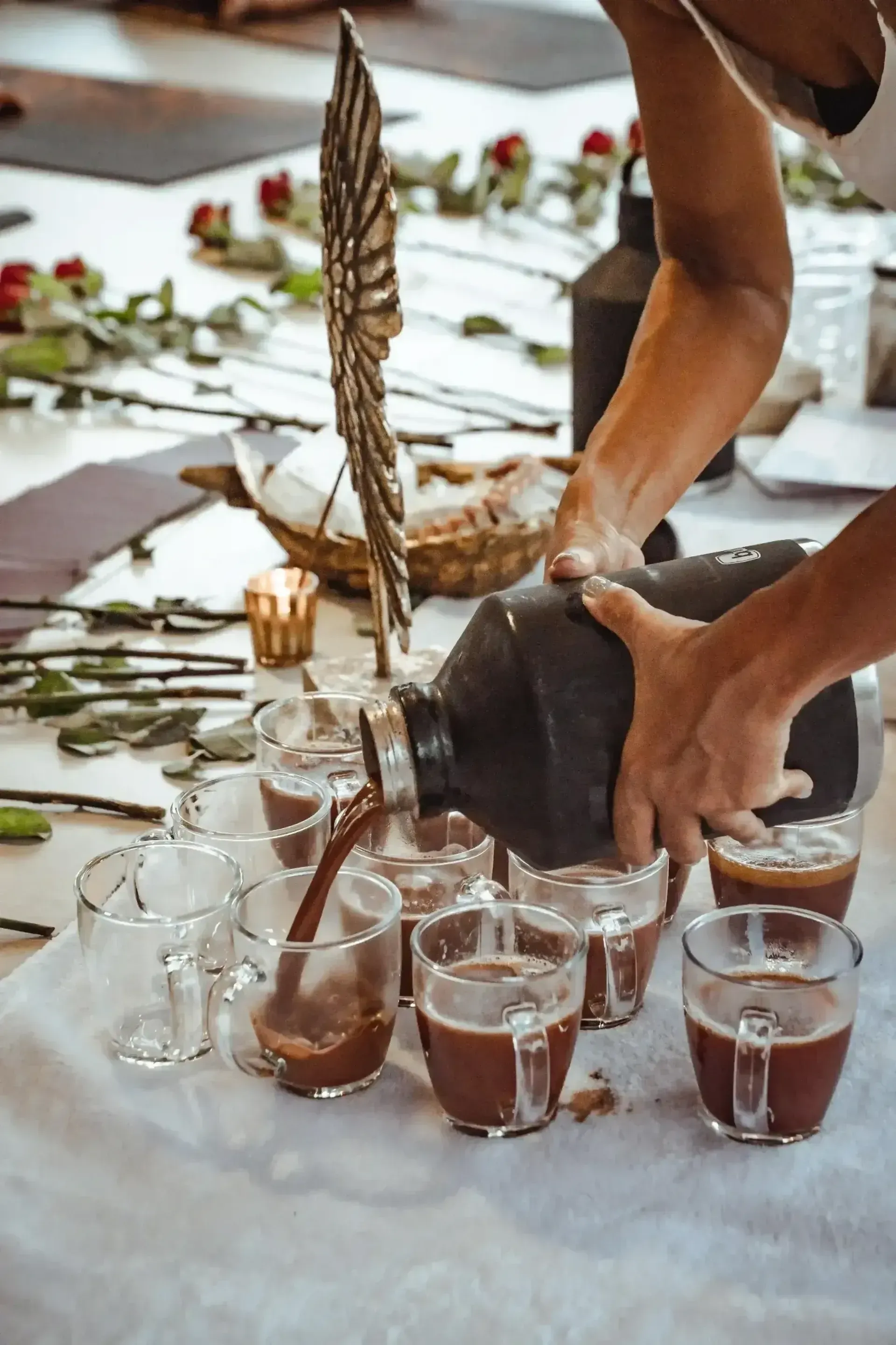 Facilitator pouring cacao for a ceremony at Vajra Jahra Retreat Center, an inspiring Corporate Retreat Venue in Costa Rica.