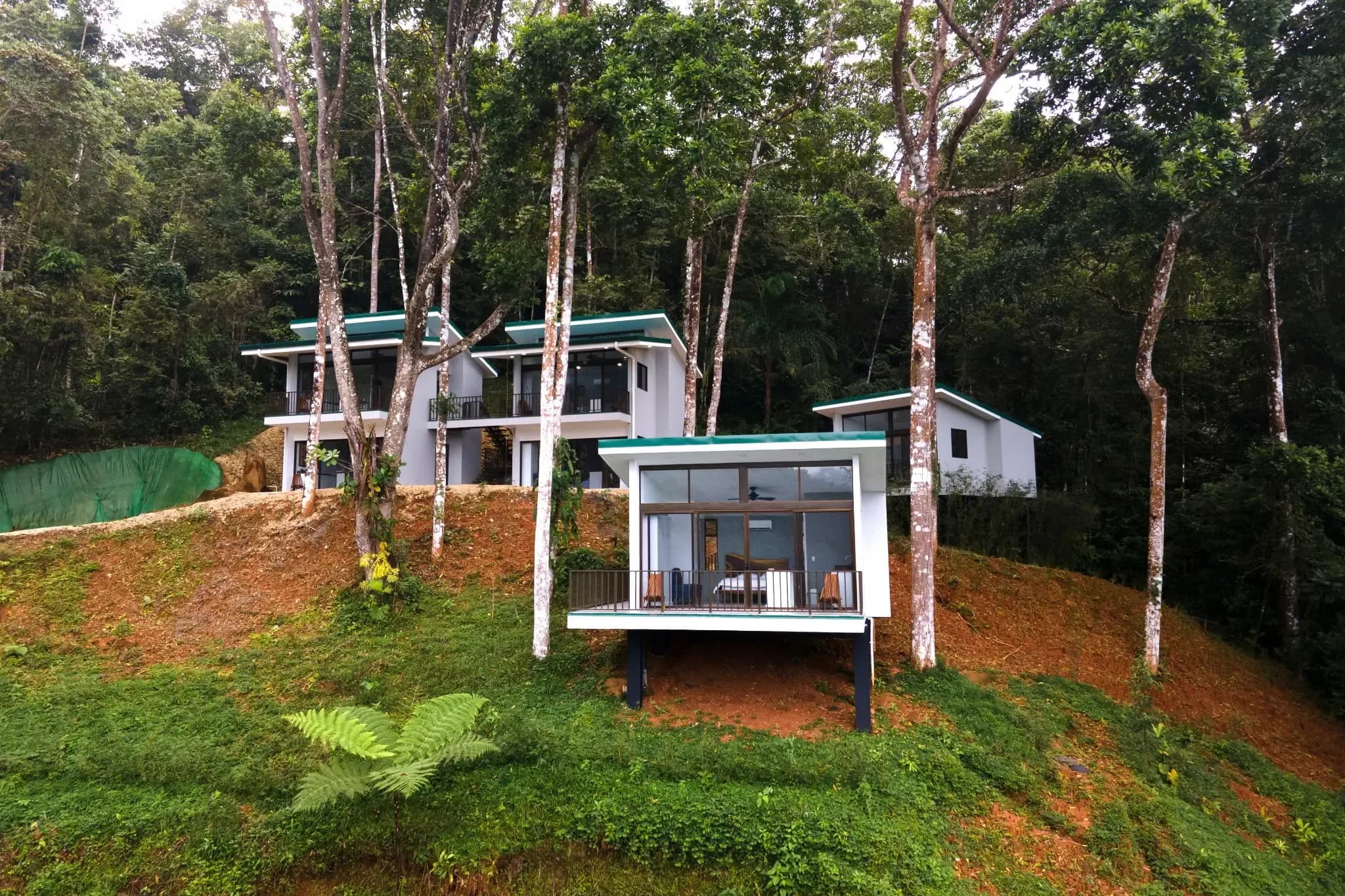 Modern hillside villas surrounded by jungle at Vajra Jahra Retreat Center, an ideal destination for family reunion vacation rentals.