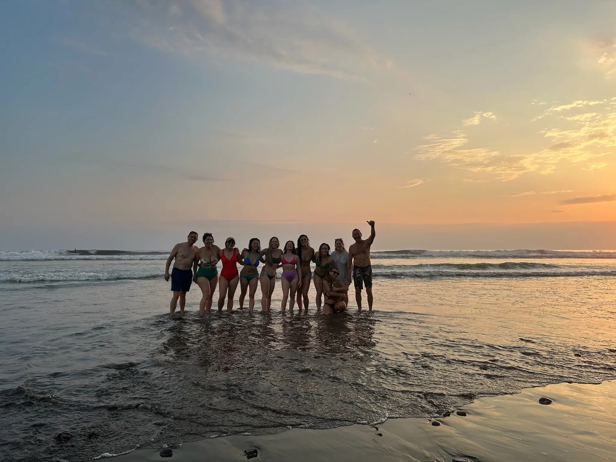 Retreat group enjoying a sunset beach outing near the Vajra Jahra Retreat Center, a top choice for those looking to Rent a Retreat Center.