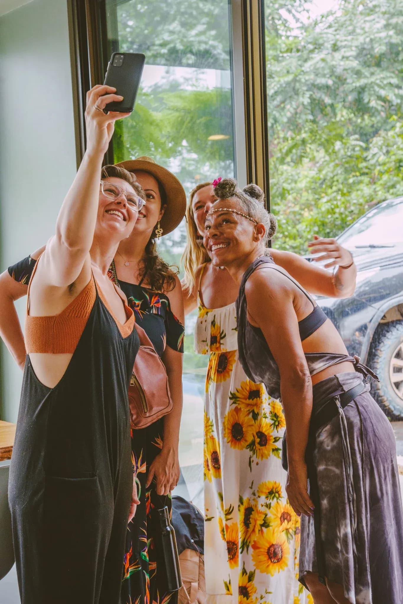Group of women smiling and taking a selfie together at Vajra Jahra Retreat Center, capturing joyful moments during a Costa Rica Yoga Teacher Training experience.